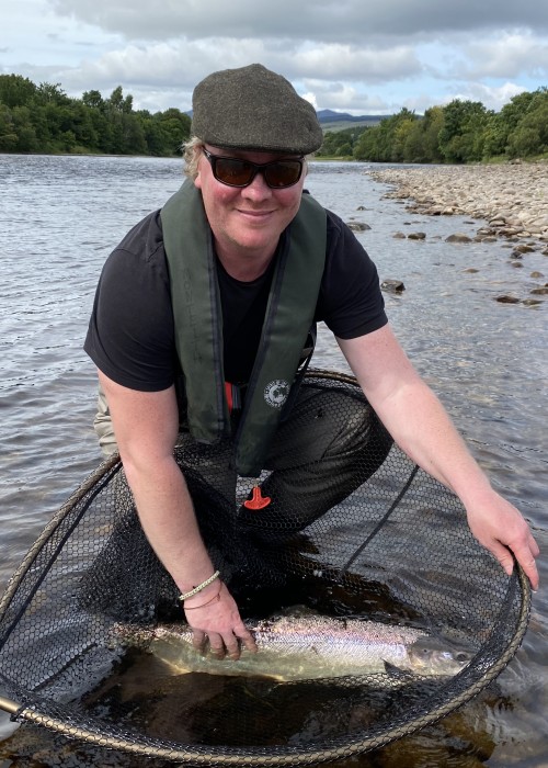 Here's guided fishing guest Tom Wellman with a perfect Summer salmon that was awaiting his fly high up at the neck of the Mike's Run Pool of the River Tummel near Ballinluig. This salmon fought tremendously in this fast water pool before we could get the situation under control via the landing net.