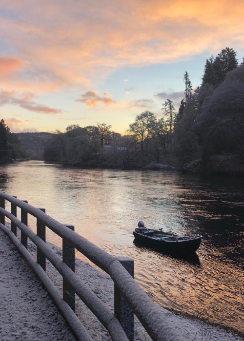 Here's a cold early morning River Tay shot from Dunkeld showing frozen snow covered riverbanks, salmon fishing boat and riverside fence in January. The sun soon melted most of what you see when it rose above the tree line on the far bank of the Tay,